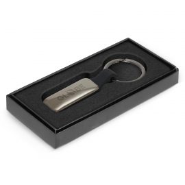 The Trends Altos Key Ring is a rectangular, opulent, silicone and metal key ring.  Engraved.  Gunmetal.  Great branded key rings for your clients.