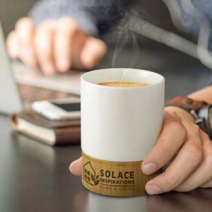 The TRENDS Kismet Coffee Mug is a deluxe 250ml ceramic coffee cup with natural bamboo base.  Printing on the bamboo.  Black gift box.
