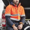 The Syzmik Unisex Hi Vis Antarctic Softshell Taped Jacket is a warm, quilted jacket with detachable hood. Available in 2 colours. Sizes XXS - 5XL, 7XL.
