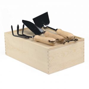The Catalogue Dig It Garden Box is a natural pine wood box with a 3 piece garden set. Includes a cultivator, spade trowel and soil hoe.