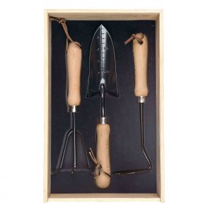 The Catalogue Dig It Garden Box is a natural pine wood box with a 3 piece garden set. Includes a cultivator, spade trowel and soil hoe.