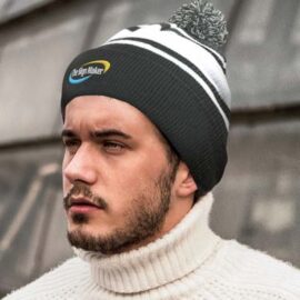 The TRENDS Commodore Beanie with Pom Pom is a warm knitted acrylic beanie with roll up cuff.  Pom pom.  Striped.  4 colours.  Embroidery available.