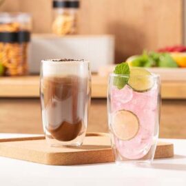 The Bodum Pavina Double Wall Glasses are a set of 2 large, double wall glass tumblers. Mouth blown, heat resistant borosilicate. Silicone vent.